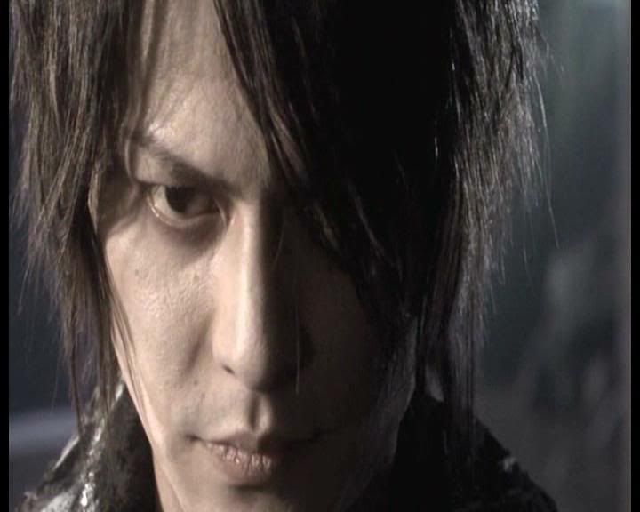 Atsushi Sakurai as the mysterious man